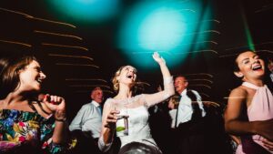 Bride and guests dancing and having fun at a garden party wedding in Kent