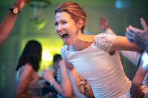 Bride dancing at a Hampden House wedding in Buckinghamshire