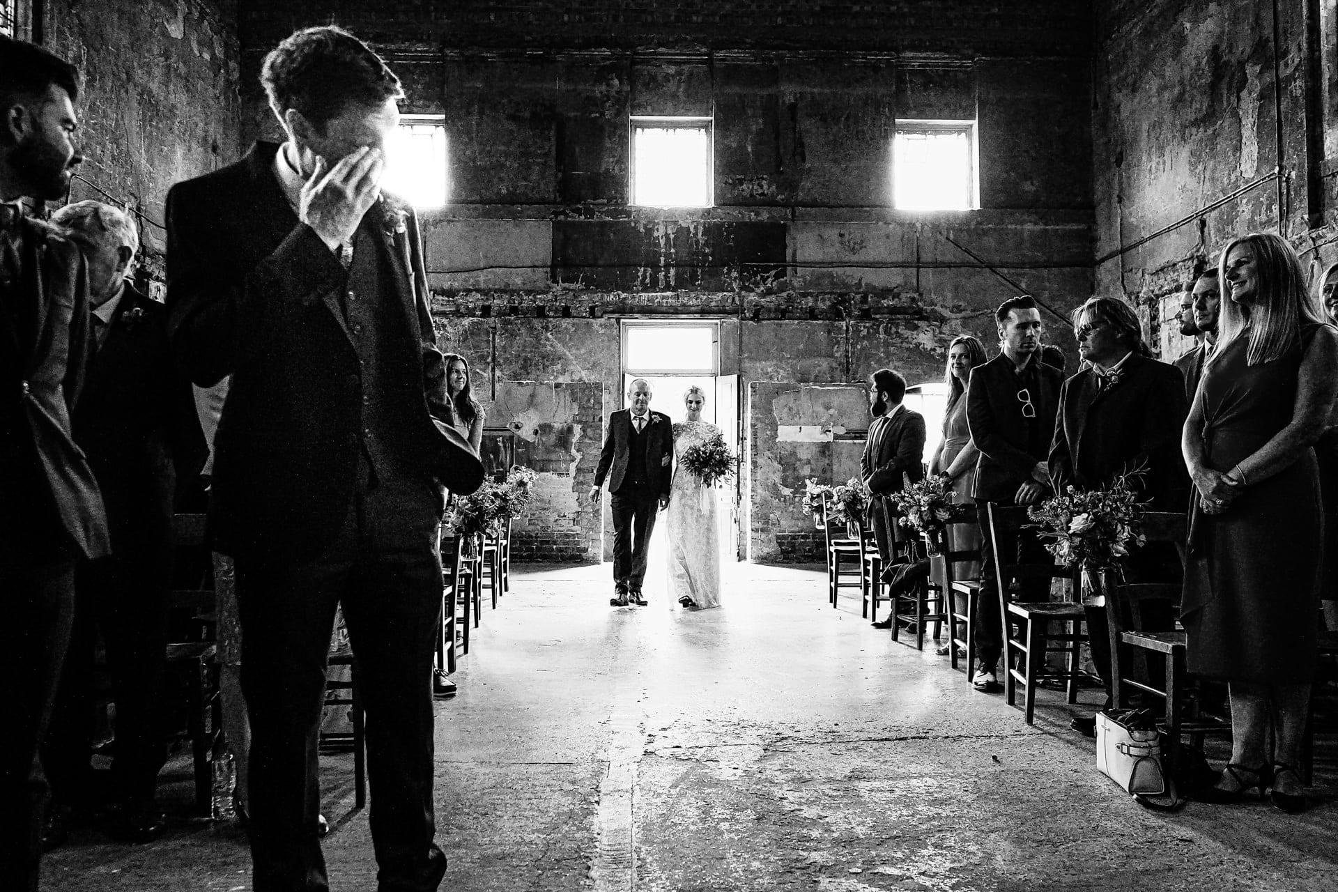 Groom crystal as bride walks down the aisle at a wedding at Asylum Chapel in Peckham London