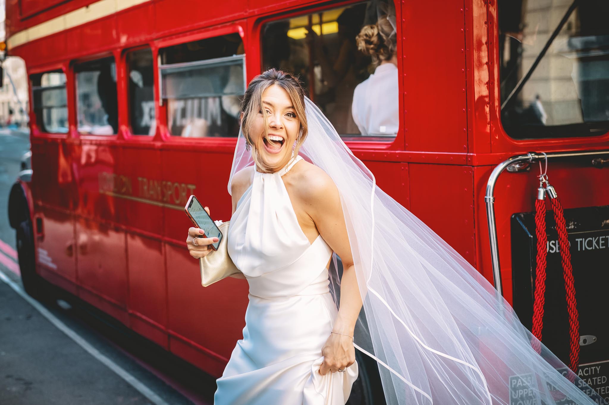 Bride getting off a London Bus