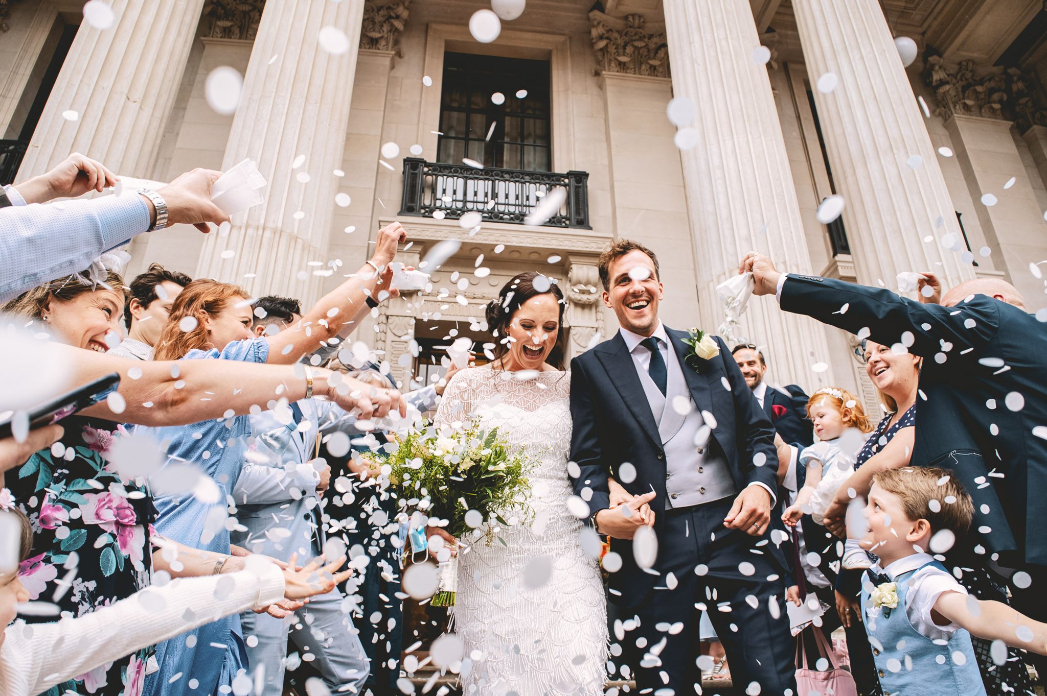 Bride and groom and confetti at Marylebone Town Hall London wedding