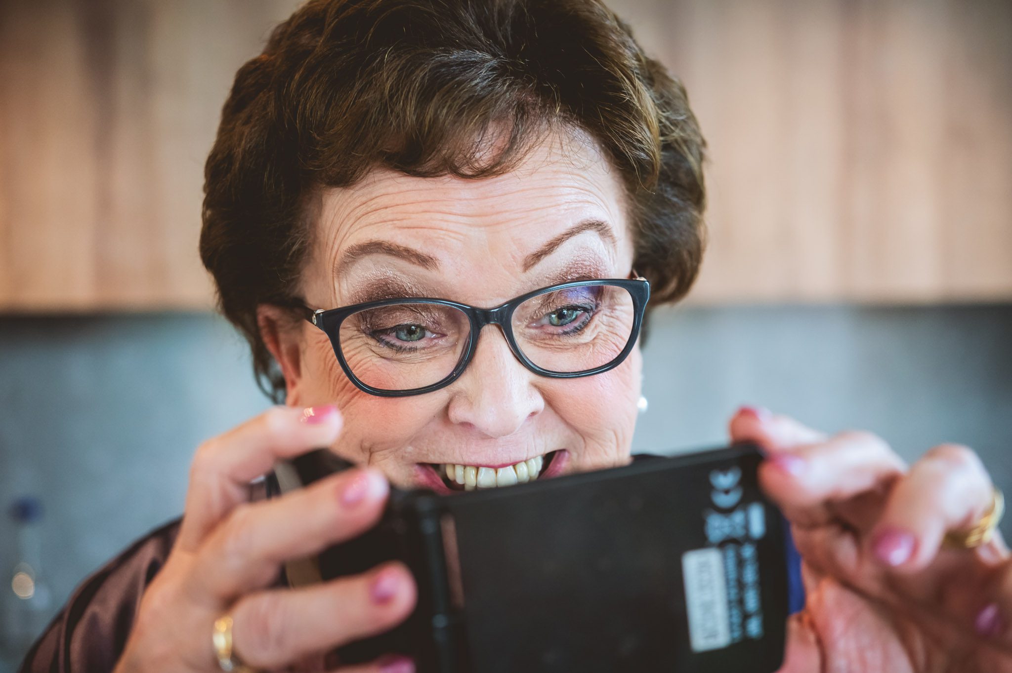 Mother of the bride taking a photo