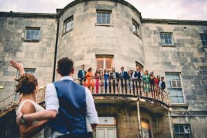 Bride and groom spot their guests at a Beckenham Place Mansion wedding in London