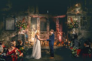 Bride and Groom holding hands at the altar at the Asylum Chapel wedding venue in London.