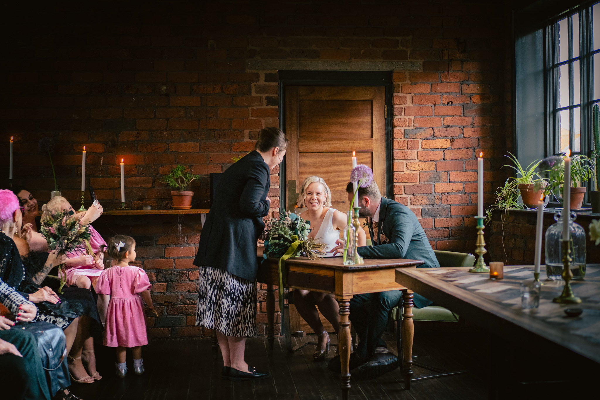 Signing the register at a relaxed Chimney House wedding in Sheffield
