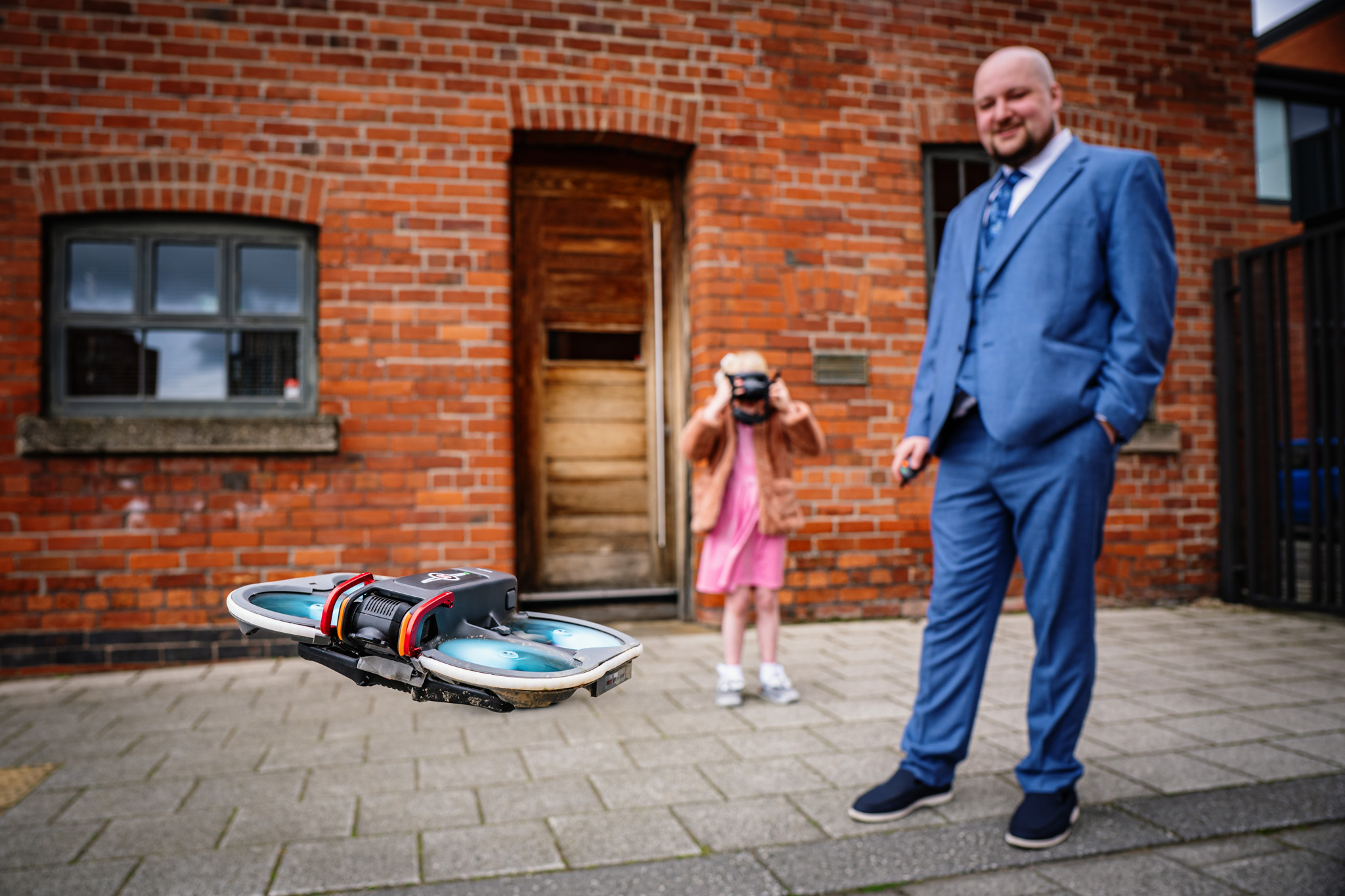 Child playing with a drone at a relaxed Chimney House wedding in Sheffield