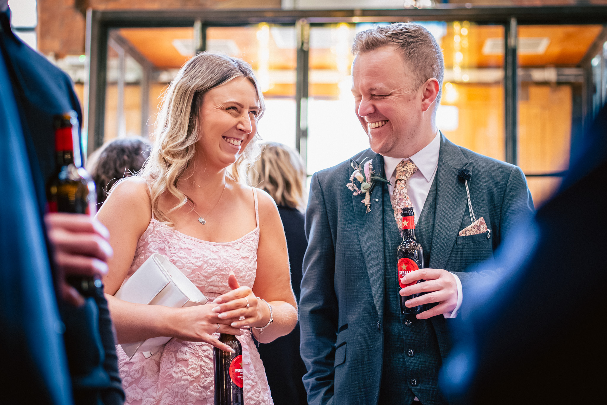 Guests laughing at a wedding reception at The Mowbray in Sheffield