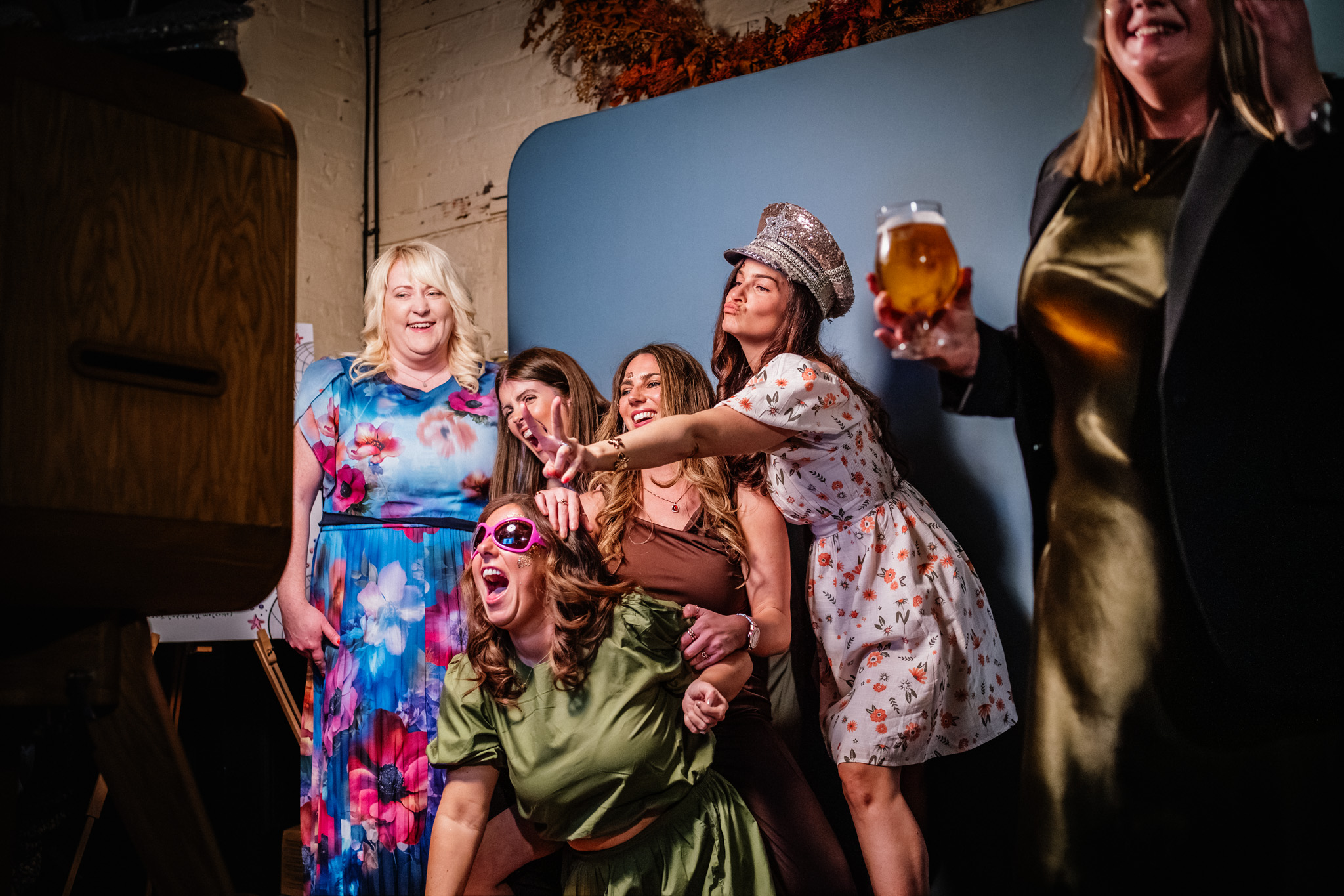 Wedding guests in a photo booth at a wedding reception at The Mowbray in Sheffield